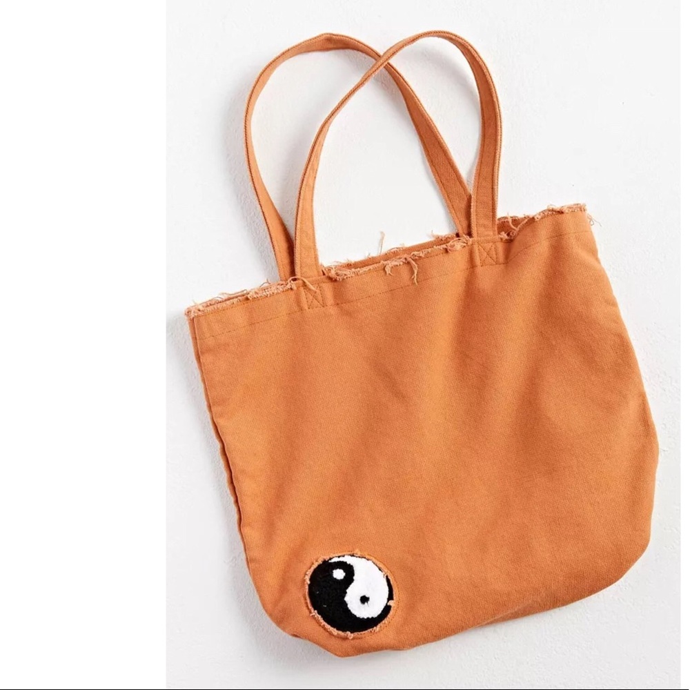 UO Distressed Yin Yang Tote